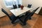 White wooden and glass round dining table with six chairs. Modern design, dining table and chairs in contemporary kitchen. Series