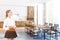 White and wooden kitchen, long table, woman