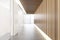 White and wooden office corridor