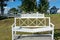 White wooden `Reconciliation Bench` in the park `Love and Fidelity`. Historically restored park, in the style of the 19th century,