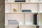 White wooden shelf indoor with different home related objects. B