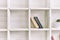 White wooden shelves with old books. Wooden bookcase.