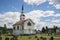 White wooden stave church near Leira in Norway