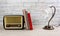 White Wooden Table with Books a Lamp and a Vintage Radio