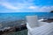 White woven chait and table at beach