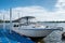 White yacht anchored in river at pier