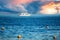 White yacht in the blue sea against the backdrop of an approaching thunderstorm and sunset. yacht in the sea at sunset. summer