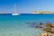 White yacht on the idyllic beach lagoon of Crete