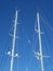 White Yacht Masts Against Clear Blue Sky