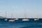White yachts anchored in a blue bay of Agia Efimia port, Cephalonia island, Greece