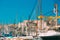 White Yachts Are Moored At City Pier, Jetty, Port In Marseille, France. Old Fortress on background