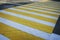 White yellow crosswalk zebra crossing. Pedestrian crossing with shadow