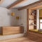 White and yellow farmhouse bathroom with wooden bathtub. Window with bench and pillows, plaster concrete walls. Japandi interior