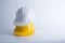 White and yellow safety helmet on white background. Hard hat and