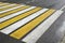 White Yellow Zebra Pedestrian Crossing On The Wet Asphalt Road