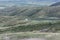 White yurt on the hill. Huge space. Mountains swathed in the clouds