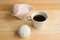 White zefir and coffee cup on wooden table