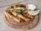 Whitebait deep fried on a wooden platter