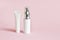 Whites cosmetic products tubes. Blank plastic container for cream, lotion, toothpaste, nourishing or moisturizing mask on a pink b