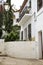 Whitewashed facades of houses with garden in Altea