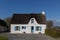 Whitewashed house with thatched roof