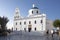 Whitewashed houses and blue dome church by the Aegean sea, Santoriniin Oia, Santorini, Greece. Famous blue domes in Oia village,