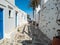 Whitewashed houses blue doors cobblestone street at Kastro village Sifnos island Cyclades Greece