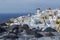 Whitewashed Houses and Windmill on Cliffs with Sea View in Oia,