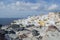 Whitewashed Houses and Windmill on Cliffs with Sea View in Oia,