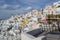 Whitewashed Houses and Windmill on Cliffs with Sea View in Oia,