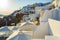 Whitewashed luxury hotels on Caldera cliff top Santorini Greece