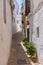 Whitewashed street of the old town of Arcos de la Frontera, one of pueblos blancos, in Spain