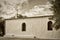 Whitewashed traditional church or hermita in a small village in Spain Sepia