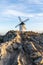 A whitewashed windmill in La Mancha in warm evening light