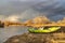 Whitewater inflatable kayak on a river shore
