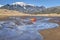 Whitewater kayak in shallow water and sand dunes