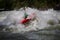 Whitewater kayaker negotiates high water rapid