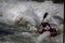 Whitewater kayaker races down stream