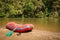 Whitewater rafting boat on shore of mountain river ready for adventure