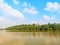 Whiteâ€‹ cloudsâ€‹ in theâ€‹ blue skyâ€‹ Cloudy natural backgroundâ€‹ beautifulâ€‹ â€‹natureâ€‹ greenâ€‹ bushâ€‹ river