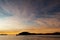 Whitsunday Islands Sunset - view from boat on the water. Clouds in the colourful sky