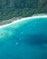 Whitsunday white sand beach aerial with boats