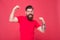 Who is cool. Strong hipster muscular arms red background. Physical strength. Strong biceps and triceps. Strong muscle