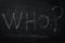Who ? The word who written in chalk on a blackboard - one of the essential questions in journalism and communication