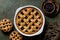 Whole baked mixed berry crust pie or tart with lattice, mini tarts.