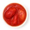 Whole canned tomatoes in white dish.