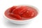 Whole canned tomatoes in white dish.