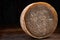 Whole Cheese Wheel on Wooden Board