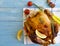 Whole chicken fried prepared, gourmet wooden background