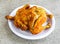 Whole chicken steam roast served in plate isolated on grey background top view of pakistani and indian spices food